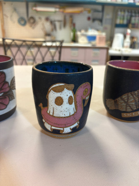 Ghost on flamingo floaty